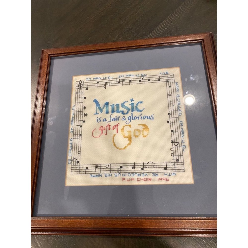 Needlepoint handmade and desgned in frame with glass